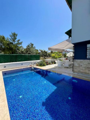 Alaçatı renovated villa with large pool